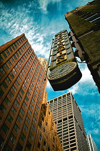 high-rise brown concrete building under blue sky during daytime thumbnail