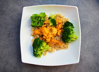 fried meat and rice with broccoli dish on white plate thumbnail