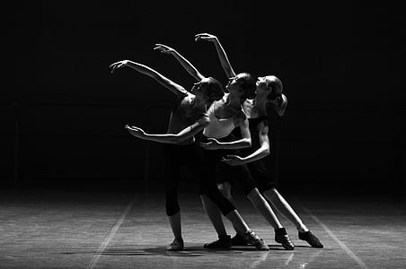 grayscale photo of three women doing a contemporary dance position thumbnail