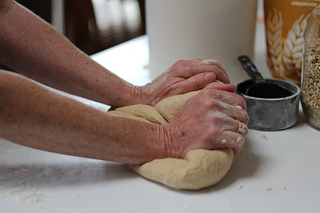 person making bread dough thumbnail