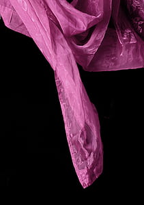 pink textile on black surface thumbnail