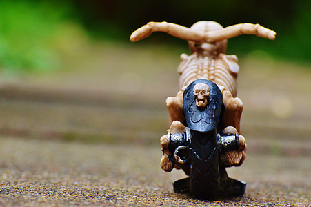 tilt shift lens photography of brown motorcycle toy thumbnail