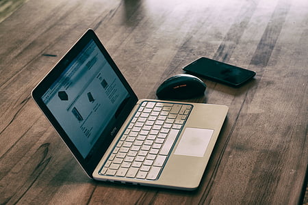 turned on laptop on table thumbnail