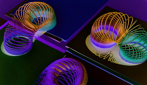three rainbow slinky toys thumbnail