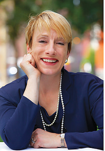 woman wearing blue suit jacket thumbnail
