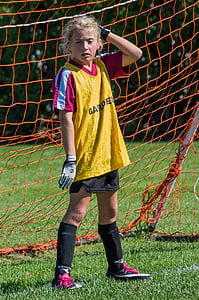 woman wearing soccer jersey near goalie thumbnail