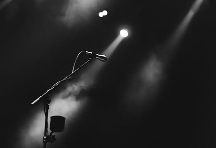 grayscale photo of microphone and stage lights thumbnail