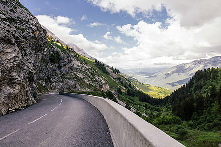 road beside rock formation thumbnail