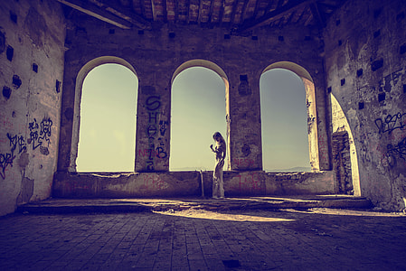 person standing beside window thumbnail