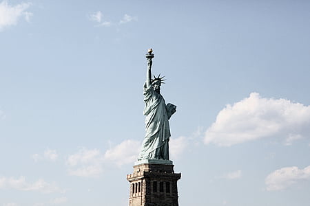 Statue of Liberty under blue sky and white clouds thumbnail