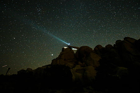 light on top of boulder during night time thumbnail