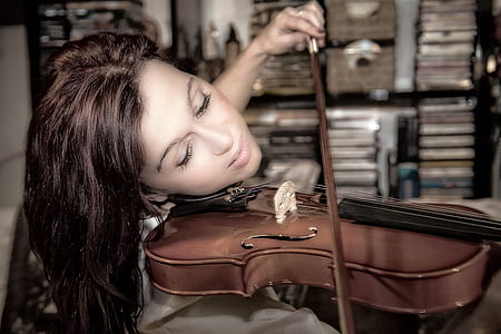 woman playing a brown violin thumbnail