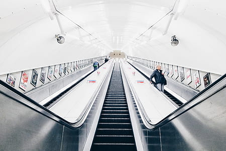 people riding escalator thumbnail