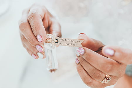 person holding vial thumbnail