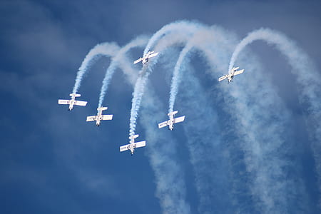 six white planes performing on air thumbnail