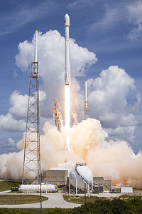 white space shuttle taking off from docking station during daytime thumbnail