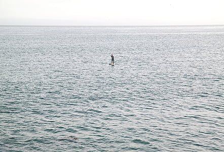 person standing on beach thumbnail