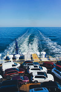 assorted-color vehicle in cross ship at daytime thumbnail