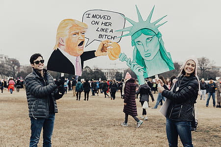 photo of man and woman holding cutout stickers thumbnail