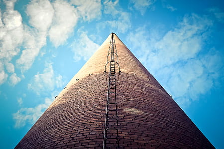 high-angle photo of brown tower with stairs during daytime thumbnail