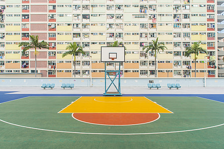 basketball field beside concrete building during daytime thumbnail