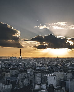 cities under dark clouds covering sun thumbnail