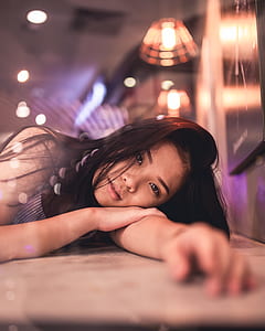 woman wearing gray and black striped top thumbnail