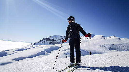 man holding ski pole during daytime thumbnail