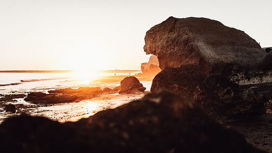 rock formation near ocean water thumbnail