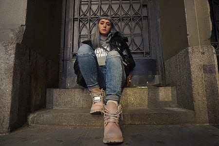 woman sitting in front of the door thumbnail