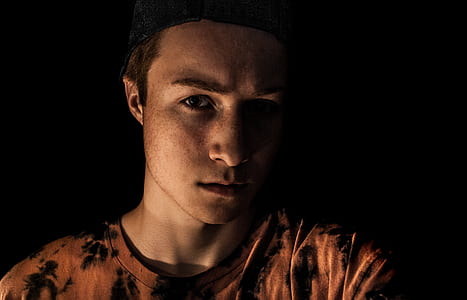 Man Wearing Brown and Black Crew-neck Shirt thumbnail
