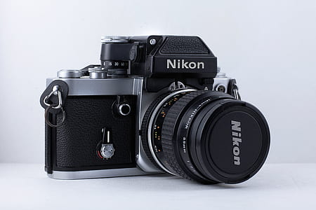 black Nikon MILC camera on white surface thumbnail