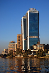 photography of blue and gray high-rise building during daytime thumbnail
