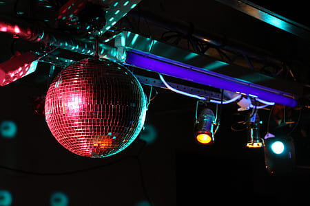 red disco ball hanging on ceiling thumbnail