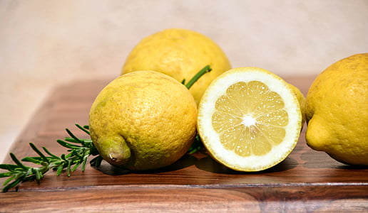 lemon on brown wooden table-top thumbnail