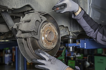 person fixing a car brake set thumbnail