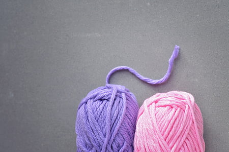 two pink and purple yarns on gray slab thumbnail