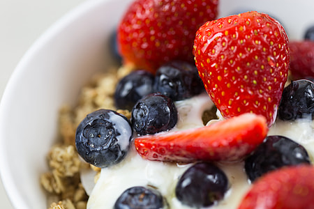 Healthy breakfast bowl containing yogurt, fruit and granola cereal thumbnail