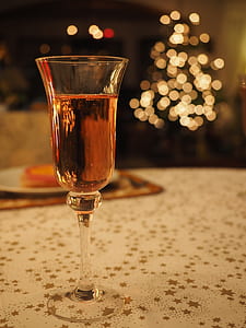 clear glass stemware with brown liquid thumbnail