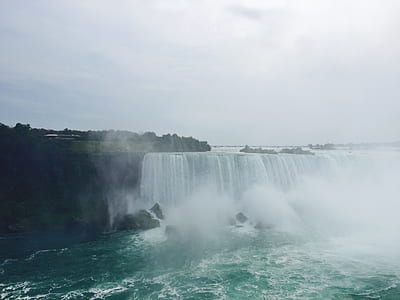 waterfalls under the cloudy sky thumbnail