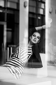 Photo of Woman Sitting on Sofa Posing thumbnail