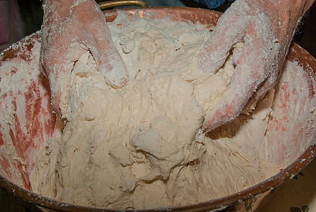 person mixing dough in bowl thumbnail