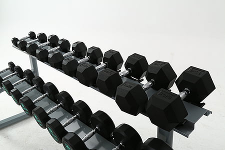black dumbbells in gray steel rack thumbnail