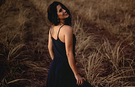 shallow focus photograph of woman in black spaghetti strap dress thumbnail