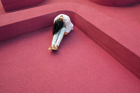 woman sitting on red floor thumbnail