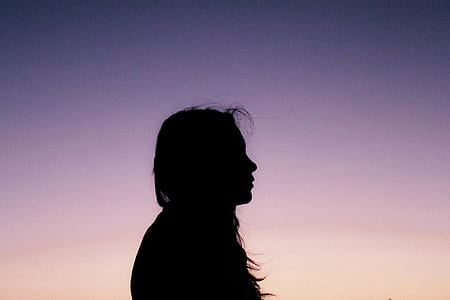 silhouette of a woman outdoor during dusk thumbnail