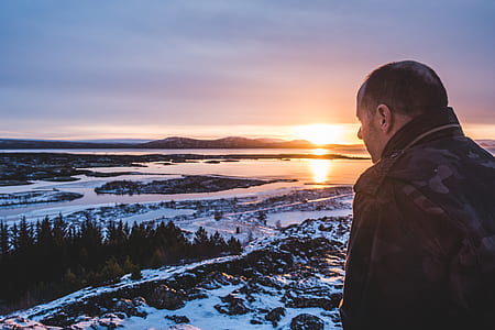 man facing on trees and body of water thumbnail