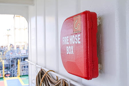 red Fire Hose Box on metal wall thumbnail