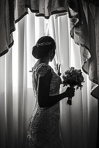 grayscale photography of woman in wedding dress thumbnail
