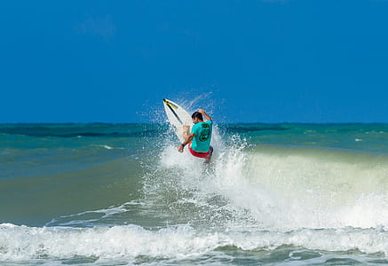 Man Surfboarding on Ocean thumbnail